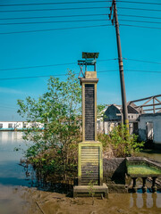 abandoned school gate due to being submerged in tidal floodwaters