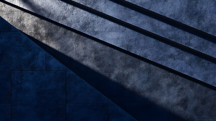 Modern concrete staircase with dramatic diagonal shadows in dark blue gray urban architecture interior