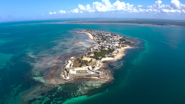 Aerial view of the Fortress of Sao Sebastiao, with a historic fort and houses on the island set against the turquoise ocean, Nampula, Nampula Province, Mozambique.