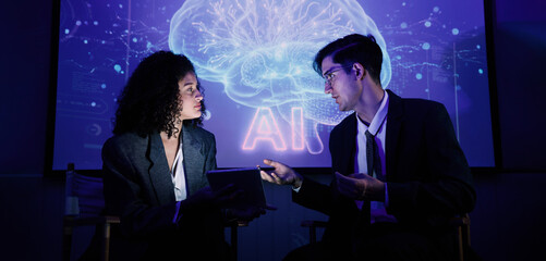 Ai using. Business team discussing and using artificial intelligence technology or Ai assistant. Futuristic innovation AI technology collaboration and ideas for future. Business Tech Startup meeting.