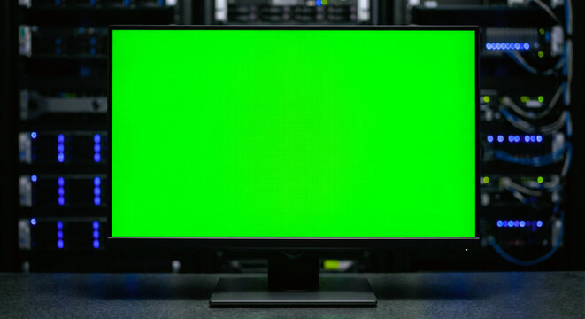 Computer Monitor with Green Screen in Modern Server Room