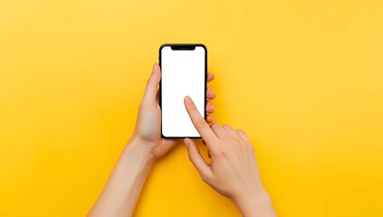 Human hands holding a modern smartphone with a blank white screen against a vibrant yellow background