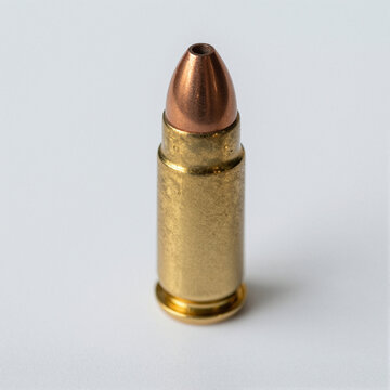 Macro shot of a hollow-point bullet tip with intricate machining details, centered on a clean white background