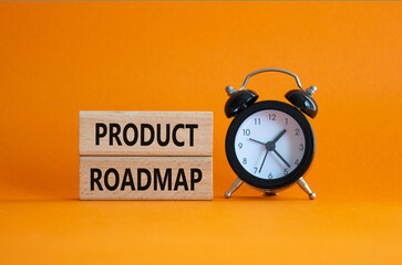 Product Roadmap symbol. Concept word Product Roadmap on wooden blocks. Beautiful orange background with alarm clock. Business and Product Roadmap concept. Copy space