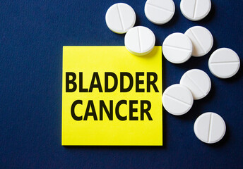 Bladder Cancer symbol. Concept word Bladder Cancer on yellow note. Beautiful deep blue background with pills. Medicine and Bladder Cancer concept. Copy space