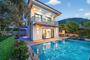 Luxury Villa with Pool: Capturing the essence of modern luxury, this villa boasts a pristine swimming pool, manicured grounds, and architectural details.