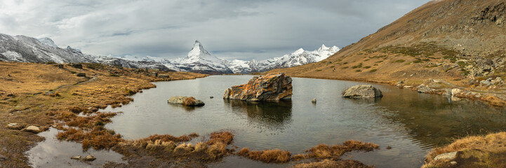 Stallisee Overlooking The Distant Matterhorn On A Cloudy Day