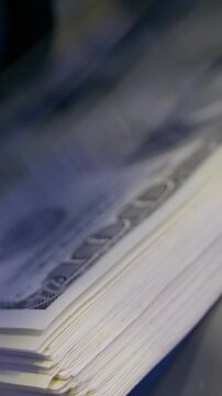 Defocused money counting process with hundred dollar banknotes