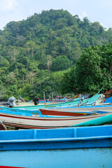 Traditional wooden fishing boats line Rajegwesi Beach, Banyuwangi, as fishermen prepare to head out to sea, capturing coastal livelihoods, maritime traditions, and daily life on Java&rsquo;s southern coast.
