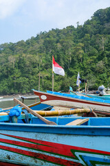 Traditional wooden fishing boats line Rajegwesi Beach, Banyuwangi, as fishermen prepare to head out to sea, capturing coastal livelihoods, maritime traditions, and daily life on Java&rsquo;s southern coast.
