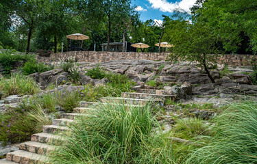 A stone wall with a path leading up to it