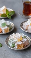 Turkish Delight Candy on Plates with Tea Sweet Dessert