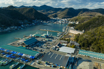 Naklejka premium Winter aerial view of a historic fishing port town and harbor in Hinase, Okayama, Japan.