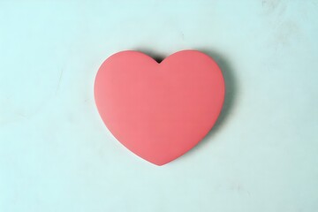 Fototapeta premium Vibrant pink heart on soft blue background for Valentine's Day