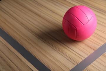 One volleyball ball on floor. Space for text