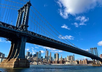 Manhattan skyline below the Brooklyn Bridge © rocky.c