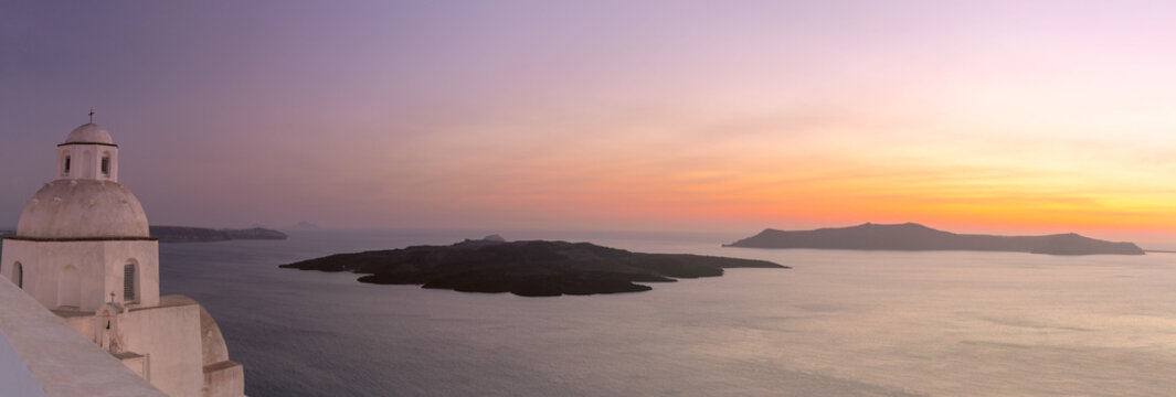 Panoramic sunset over the caldera with church dome in Santorini, Greece - Powered by Adobe