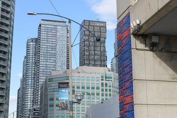 Naklejka premium looking north on Blue Jays Way near Rogers Centre to condominium complexes office towers and a banner for MLA 2026 convention, Toronto
