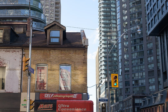 heritage building facade and sign of Ultra Convenience (and Self-photograph-ie) located at 568 Yonge St (built 1876) intersection of Wellesley St W, Toronto