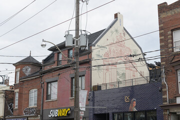Naklejka premium exterior buildings and signs of Taberna LX (a restaurant) and Subway (a sandwich shop), located at 1161 and 1159 Dundas St W, Toronto