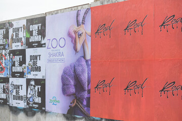 Naklejka premium street posters on a hoarding in Toronto at Perth Av south of Bloor St W “Don’t Be Dumb