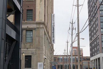 Naklejka premium exterior projecting sign outside The Museum of Contemporary Art Toronto Canada (MOCA), located at 158 Sterling Rd, a repurposed former automobile manufacturing building