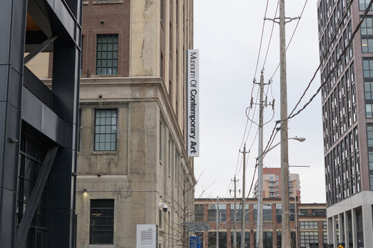 exterior projecting sign outside The Museum of Contemporary Art Toronto Canada (MOCA), located at 158 Sterling Rd, a repurposed former automobile manufacturing building