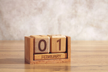 February 01, wooden calendar on table. date of event, birthday and holiday.