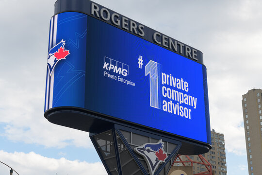 Gardiner LED pylon digital sign featuring KPMG ad near Rogers Centre, home of the Toronto Blue Jays