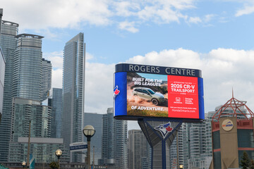Obraz premium wide view of LED pylon sign south of Rogers Centre with ad for The 2026 CR‑V TrailSport made by Honda, Toronto
