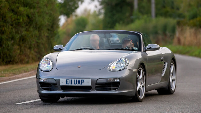 Whittlebury,Norhants,UK - Aug 23rd 2025:  2007 Porsche Boxster car driving on a British road