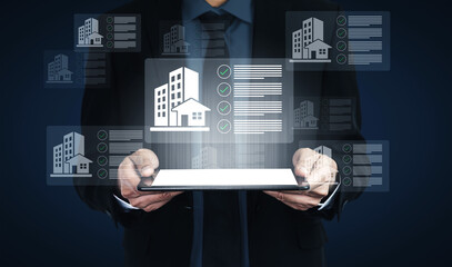 A business professional utilizes a digital tablet to analyze property data in a modern office. This scene captures the importance of technology in real estate investment and decision-making. Gantry