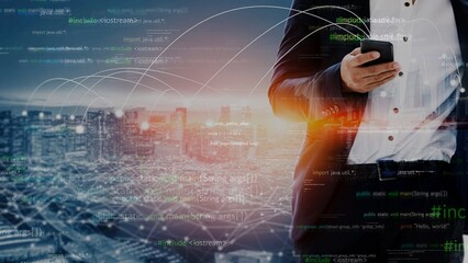A professional businessman holds a smartphone against a city skyline, with digital code overlay, illustrating the fusion of technology and finance in contemporary business. Xenic