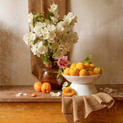 Still life with a plate of apricots, a bouquet of jasmine in a vase in yellow, orange and brown tones