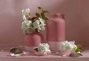 Still life with vases and jasmine in white, pink and green tones