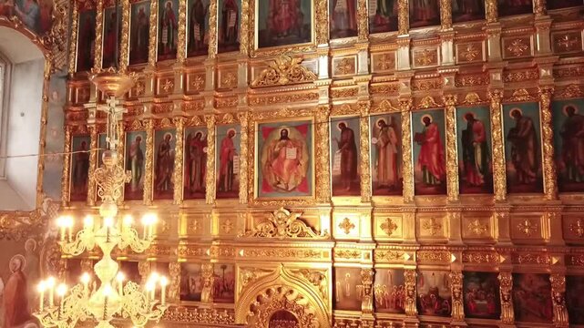 Drone descending before gilded icon wall