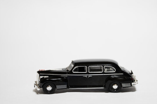 Bucharest Romania 10 January 2026. Black ZIS-110 scale model limousine isolated on white background. Classic Soviet luxury car miniature with vintage design and chrome details