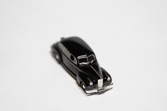 Bucharest Romania 10 January 2026. Black ZIS-110 scale model limousine isolated on white background. Classic Soviet luxury car miniature with vintage design and chrome details