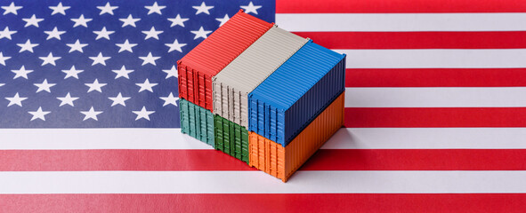 Cargo containers on the US flag as a conceptual backdrop for goods export and logistics. Cargo containers