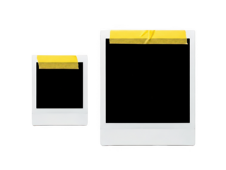 Two White Frames with Yellow Tape Over Corners on Black Background
