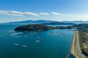 Obraz premium Winter aerial view of a fishing port town and solar panels in Ushimado, Okayama, Japan.