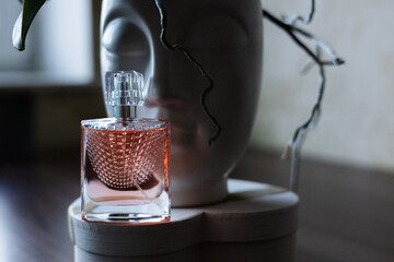 Women's pink perfume and flowers