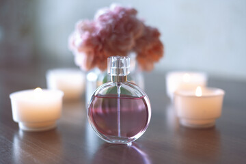 Women's pink perfume and flowers