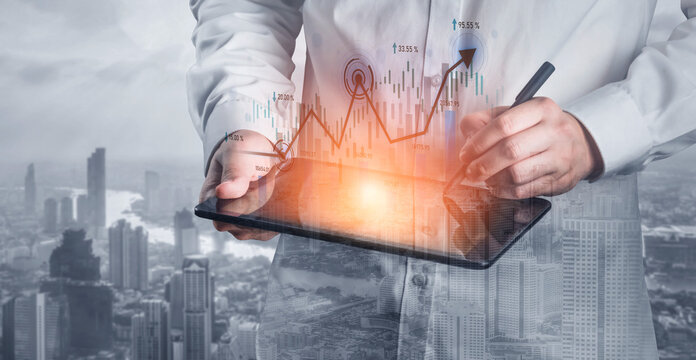 A businessman examines financial data on a digital tablet, surrounded by graphical market trends and a cityscape background, symbolizing modern business insights. Scalp - Powered by Adobe