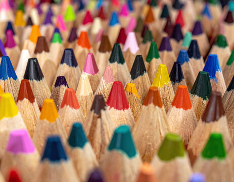 Explore a vibrant sea of sharp colored pencil tips in this macro shot. Symbolizing creativity and diversity, its perfect for educational, artistic, and modern designfocused projects.