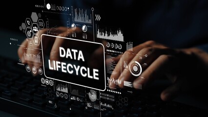 Hands Typing on Keyboard with Data Lifecycle Concept Overlay and Graphical Elements in a Dark Environment. Asymptotic smart data analytic.