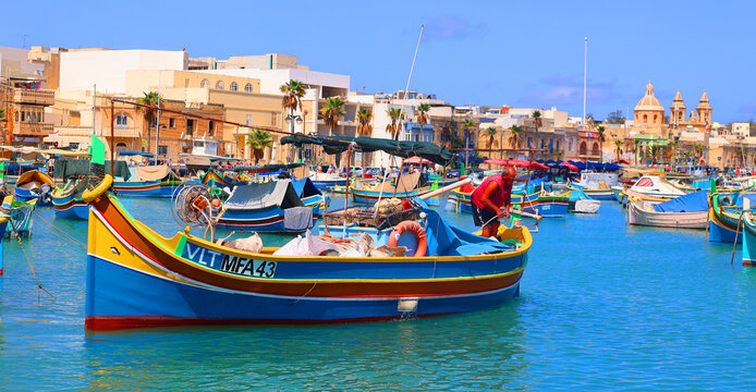 The Luzzu is an iconic Maltese fishing boat, renowned for its vibrant colours and symbolic eyes painted on the prow. Dating back to Phoenician times. MARSAXLOKK MALTA 