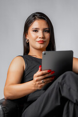 Fototapeta premium Portrait of serious business woman holding digital tablet