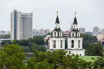 Belarus. Minsk. Top view of the Cathedral of the Descent of the Holy Spirit and modern skyscrapers.