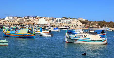 The Luzzu is an iconic Maltese fishing boat, renowned for its vibrant colours and symbolic eyes painted on the prow. Dating back to Phoenician times. MARSAXLOKK MALTA 